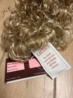 Curly, short haired wig in Light Blonde by the Wig Company